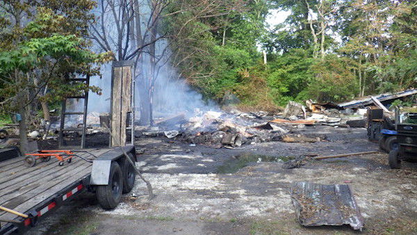 Bayly Road garage burns a third time